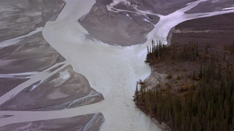 Aerial view of braided river flowing through tundra landscape Stock Footage 335106331