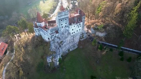 Aerial view of Bran Castle surrounded by autumn forest in Romania Stock-Footage 341328659