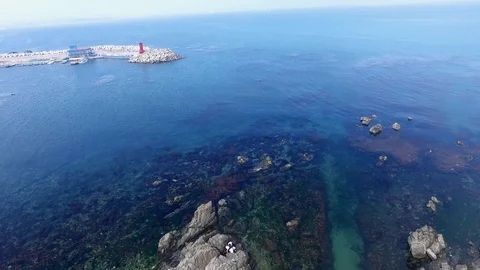 Aerial View of Breakwater with lighthouse Video stock 102608959