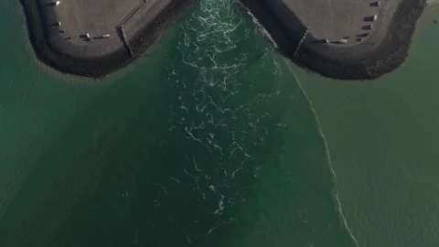 Aerial view of breakwater structure splitting ocean water Stock-Footage 346958583