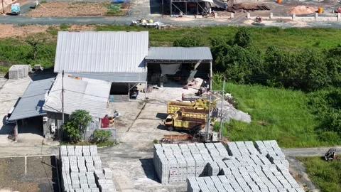 Aerial view of a brick making factory with the activities of workers moldin.. Stock Footage 339257178