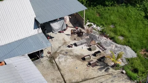 Aerial view of a brick making factory with the activities of workers moldin.. Stock Footage 339257676