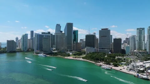 Aerial view of Brickell Key with high-rise buildings on horizon. Boats speeding Stock-Footage 256448151