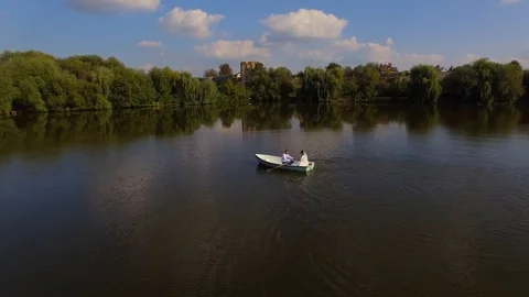 Aerial view of bride and groom on the boat Stock Footage 101148875