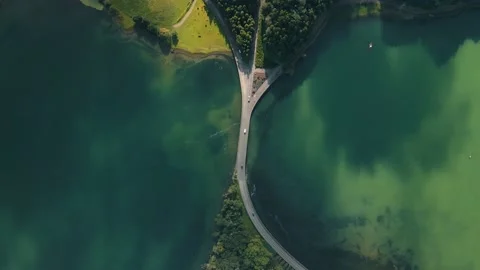 Aerial view of a bridge between Crater Lake Lagoa Verde and Lagoa Azul in Azores Stock Footage 224513416