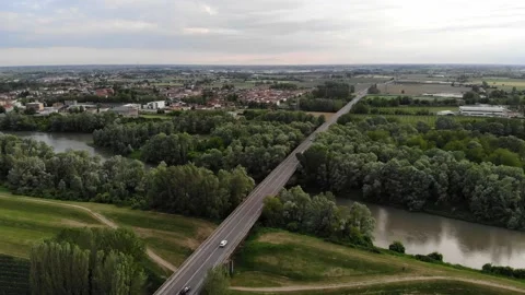 Aerial view of a bridge crossing a river and a forest. Stock Footage 130215545