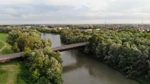 Aerial view of a bridge crossing a river and a forest. Stock Footage 130215611
