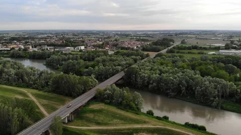 Aerial view of a bridge crossing a river and a forest. Stock Footage 130215625