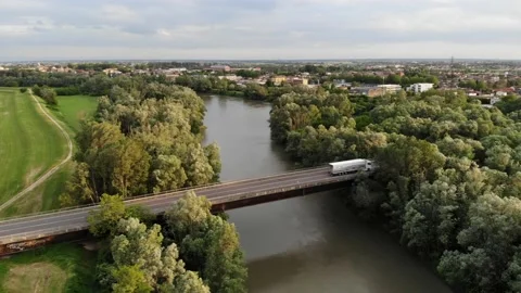 Aerial view of a bridge crossing a river and a forest. Stock Footage 130215627