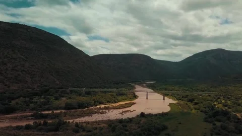Aerial view of  a Bridge Crossing A River Stock Footage 338359116
