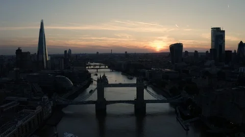 Aerial view of bridge crossing thames river during sunset, London, England. Stock Footage 128525925