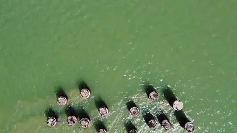 Aerial view of bridge foundations embedded in the seabed Stock Footage 274058834