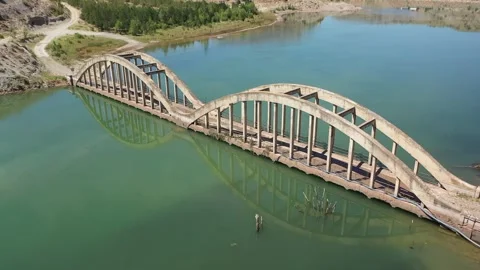 Aerial view of bridge over dam Stock Footage 294091501