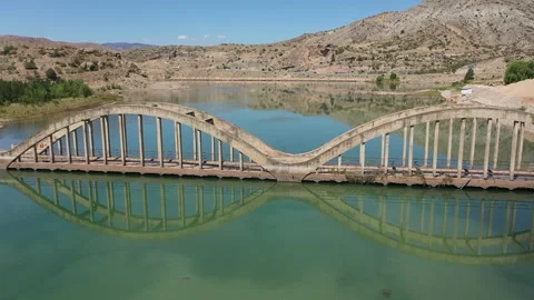Aerial view of bridge over dam 3 Stock Footage 294091943