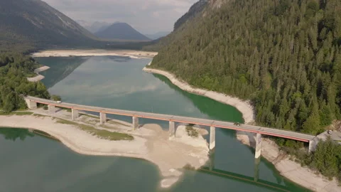 Aerial View of Bridge Over Emerald Alpine Lake in Tyrol Austria Stock Footage 340483826