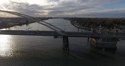 Aerial view of bridge over river landscape, sunset Stock Footage 101146420