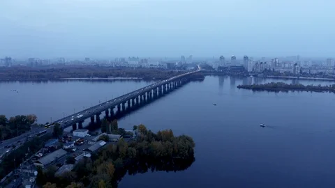 Aerial view of bridge over river Dnipro, Kyiv. Cars crossing water over highway Stock Footage 104819860
