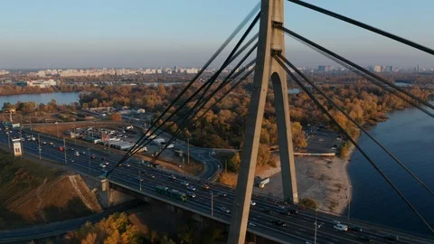 Aerial view of bridge over river Dnipro, Kyiv. Cars crossing water over highway Stock Footage 104845000