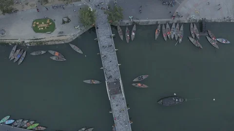 Aerial view of bridge over river, floating boats, Hoi An old town, Vietnam Stock Footage 128224339