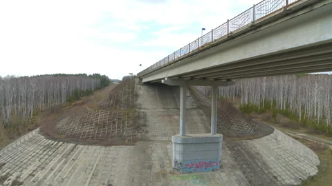 Aerial view of the bridge over the river that cars ride. Video stock 133216829