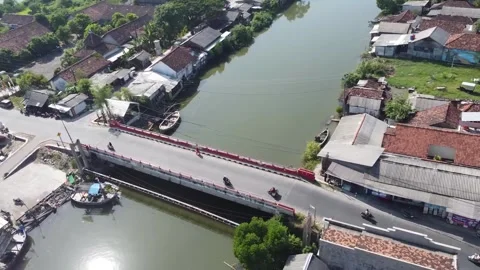 Aerial view of a bridge over a river in a residential area Stock-Footage 279136805