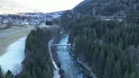 Aerial View of a Bridge Over a River in Carinthia, Austria in Winter Stock Footage 288041478