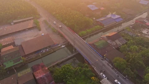 Aerial view of bridge over river at Damnoen Saduak with sunrise, Thailand Stock Footage 304439335