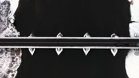 Aerial view of bridge over river with passing cars Video stock 330272529