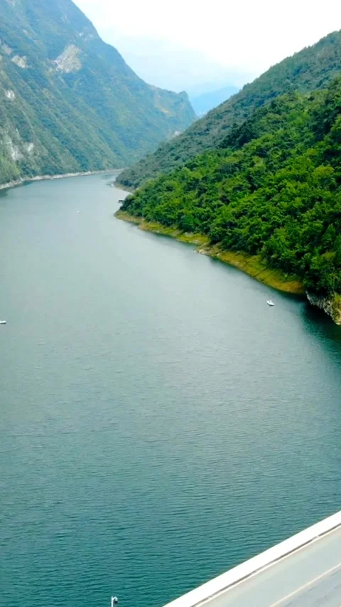 Aerial view of bridge over river in green mountains Video stock 331935067