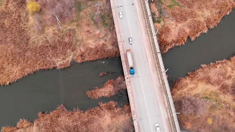 Aerial view of a bridge over a small river in the countryside Stock Footage 127512929