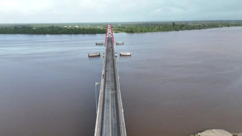 Aerial view of the bridge with red and white paint stretching across it Stock Footage 327542530