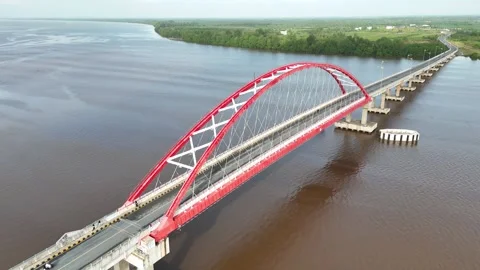 Aerial view of the bridge with red and white paint stretching across it Stock Footage 327542539