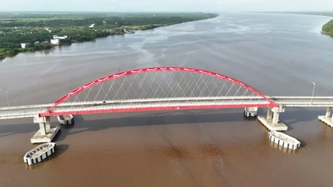 Aerial view of the bridge with red and white paint stretching across it Stock Footage 327542735