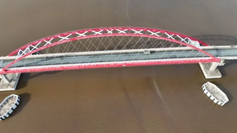 Aerial view of the bridge with red and white paint stretching across it Stock Footage 327542770