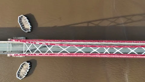Aerial view of the bridge with red and white paint stretching across it Stock Footage 327543190