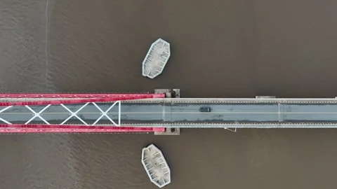 Aerial view of the bridge with red and white paint stretching across it Stock Footage 327543215