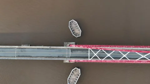 Aerial view of the bridge with red and white paint stretching across it Stock Footage 327543520