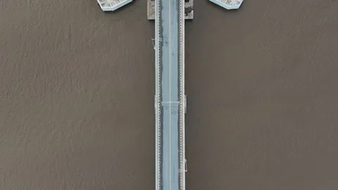 Aerial view of the bridge with red and white paint stretching across it Stock Footage 327543654