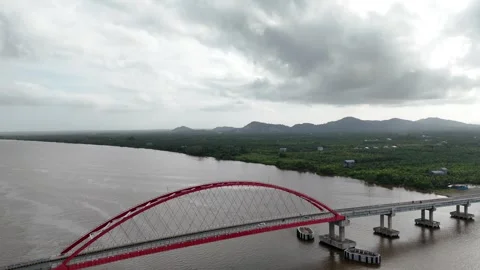 Aerial view of the bridge with red and white paint stretching across it Stock Footage 327543666