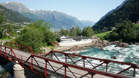 Aerial view of a bridge, river and small town with fjord Stock Footage 115630497