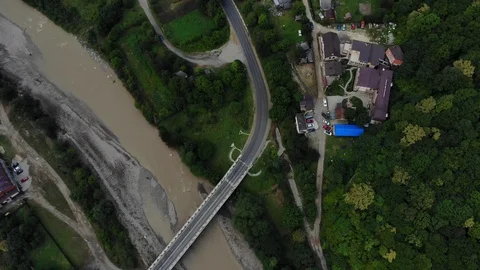 Aerial view of the bridge, river and asphalt road. Bridge from the air. Stock Footage 118165254