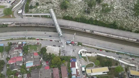 Aerial view of Bridge, river, highway and housing area in Kampung Baru Stock Footage 150290506