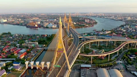 An aerial view of a bridge spanning a river in a bustling cityscape Stock Footage 312391641