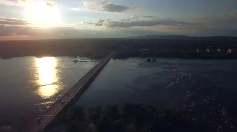 Aerial view of Bridge tracking car over sunset in the summer Stock Footage 56312654