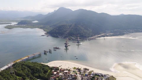 Aerial view of the bridge under construction connecting Guaratuba and Caiobá in Stock Footage 313575427