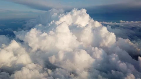 Aerial view of bright cumulus clouds covering the landscape from above Video stock 342132078