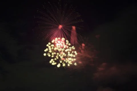 Aerial view of bright fireworks exploding with colorful lights against dark Foto stock