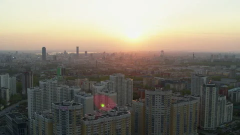 Aerial view of the bright orange sunset over the city. Video stock 134340286