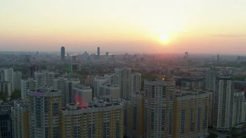 Aerial view of the bright orange sunset over the city. Video stock 134380281