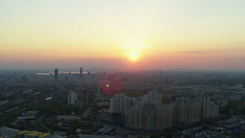 Aerial view of the bright orange sunset over the city. 스톡 동영상 134388610